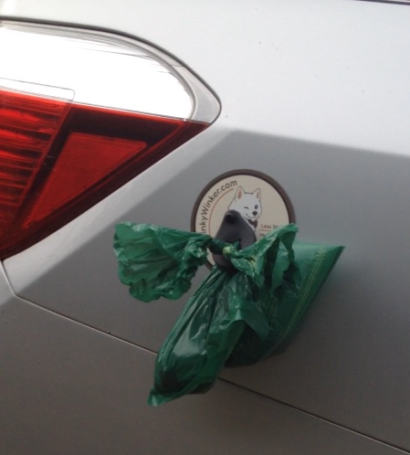Winker snapped to the car door with bag hanging